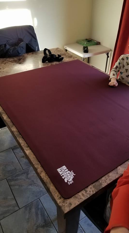 red gaming mat on dining table